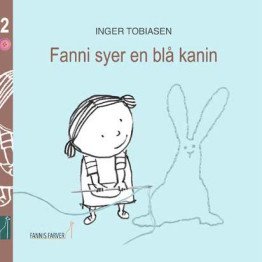 Fanni sews a blue rabbit